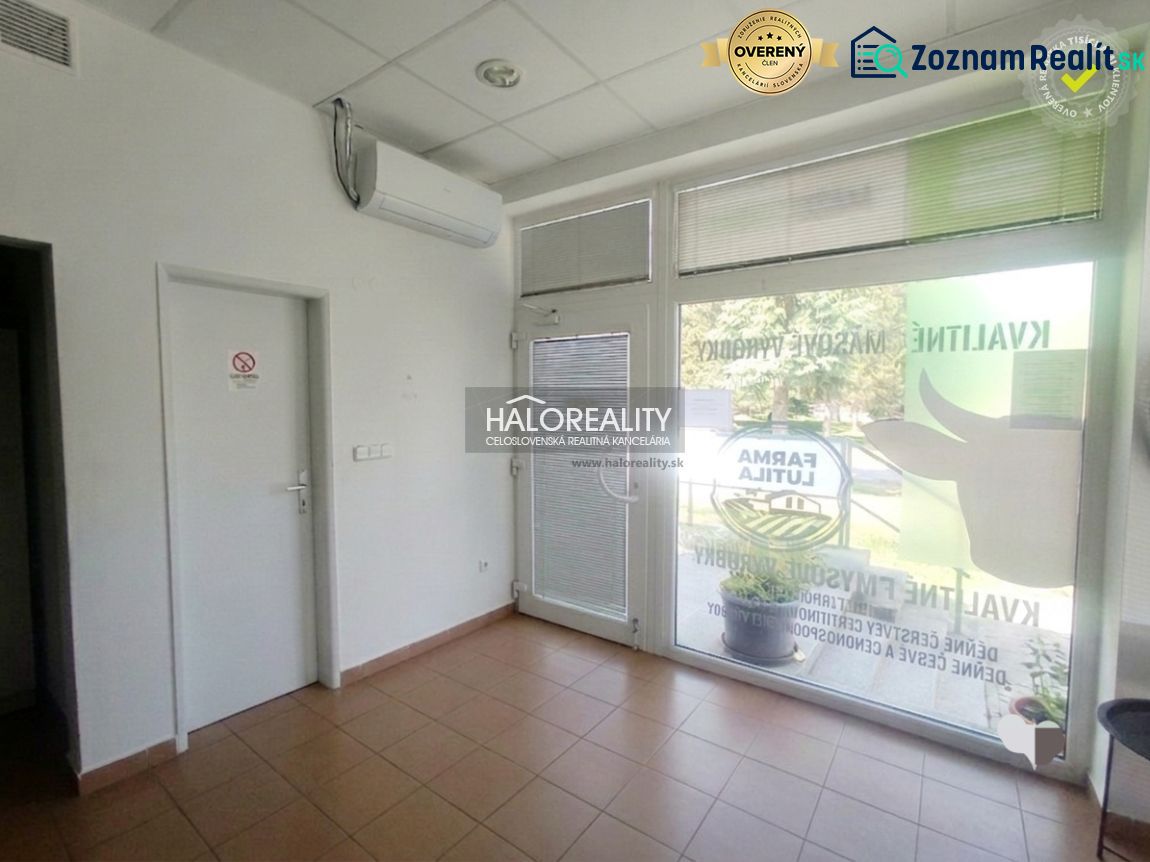 Commercial premises with tiles, air conditioning, and modern glass doors.