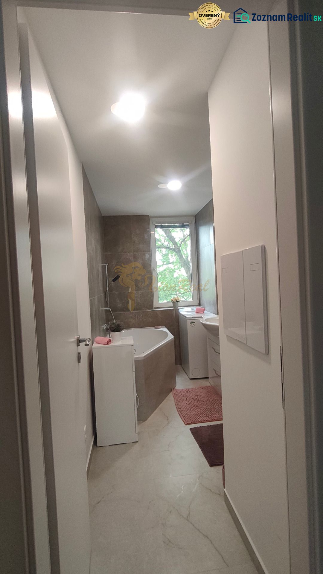 A bathroom with a shower, bathtub, sink, and washing machine in a 4-room apartment.