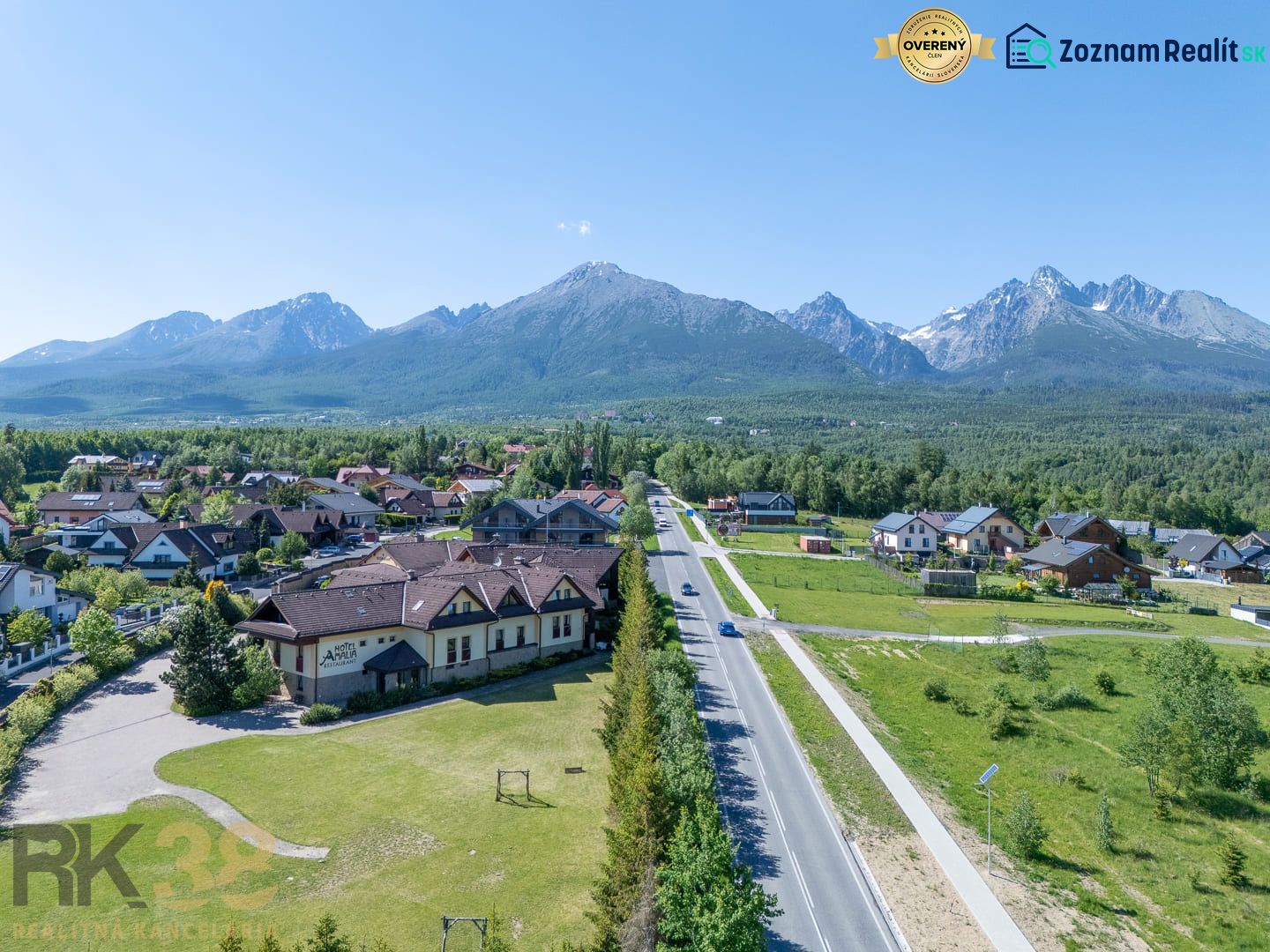 A view of hotels and guesthouses in Nová Lesná with the High Tatras in the background.