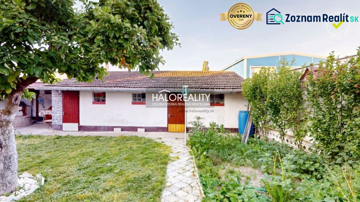 A family house in Senica with a garden, trees, and a garden shed.
