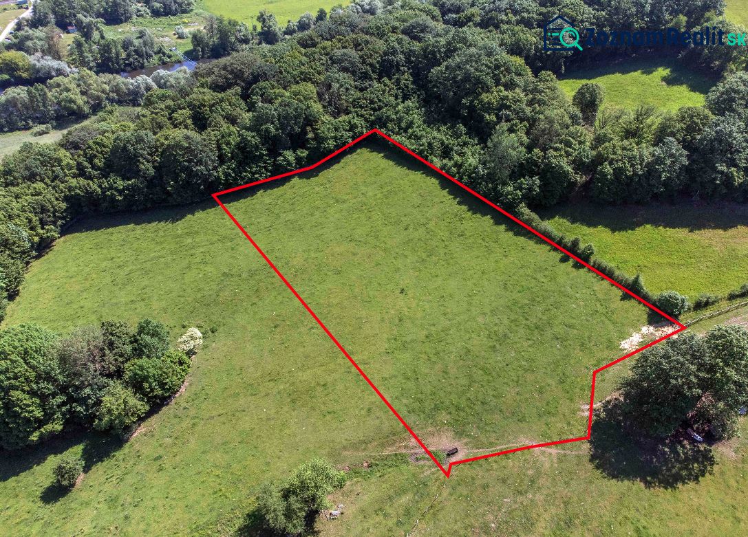 Aerial view of recreational plots in Ostrá Lúka with a forest in the background.