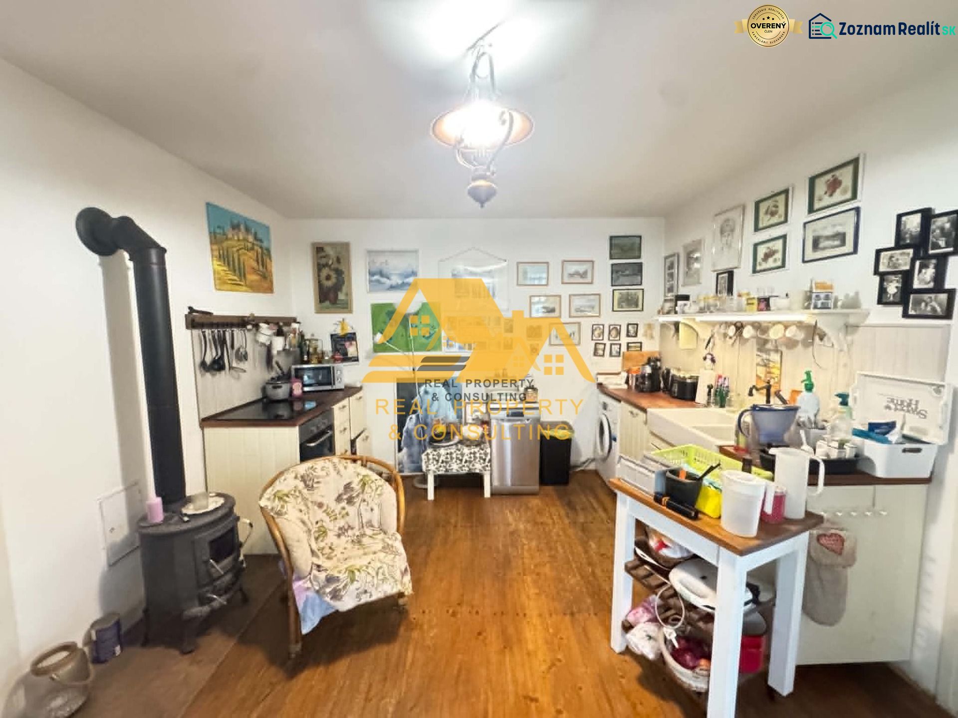A kitchen in a family house with a wooden decor floor and lots of decorations.