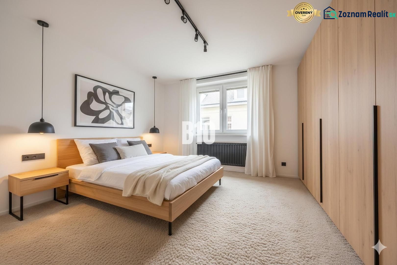A bright bedroom in a 4-room apartment with a large bed and a built-in wardrobe.