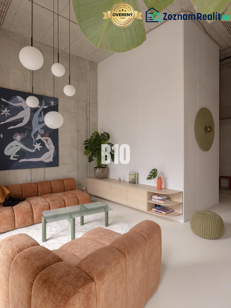 Living room with a brown sofa, coffee table, and modern lighting in a 2-room apartment.