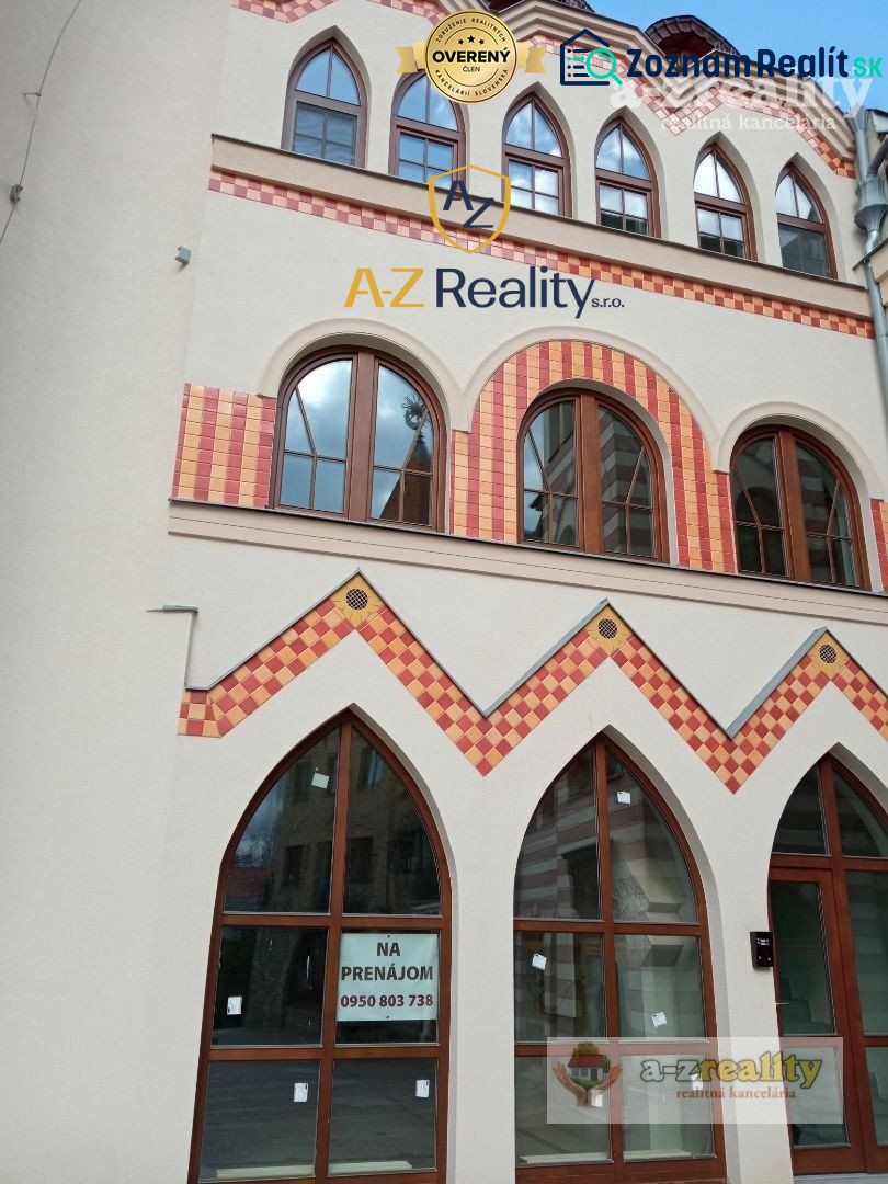 A building with colorful bricks and arched windows at the Courtyard of Europe in Komárno.