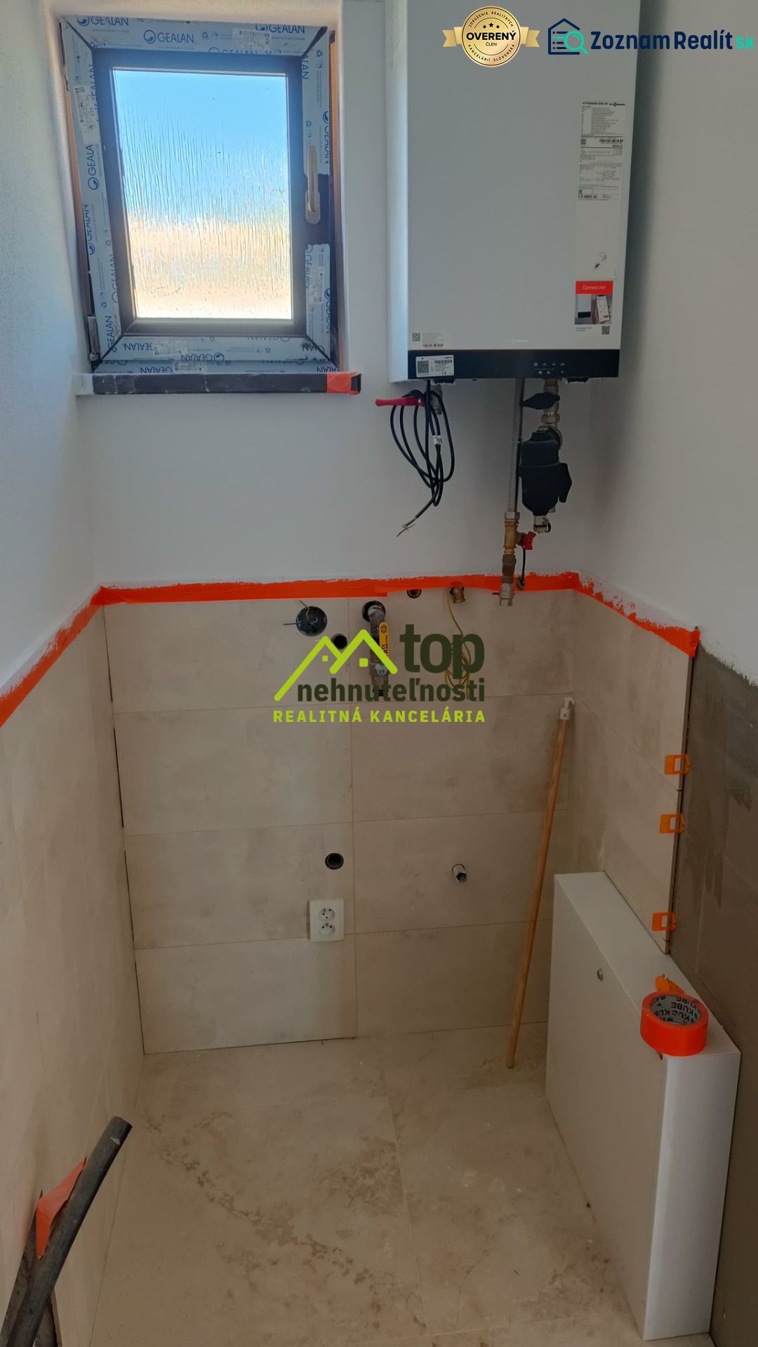 Room with a window and a boiler in a family house.