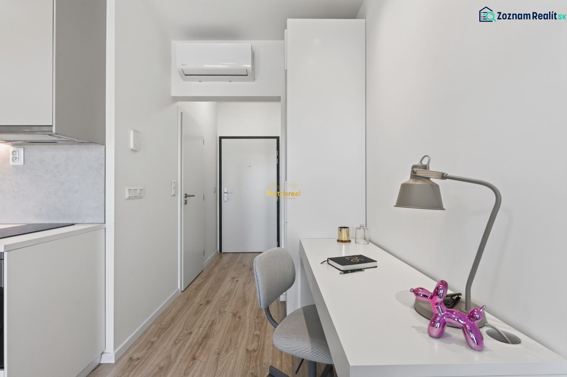 A workspace with a lamp and decoration, Studio apartment, floor with wood decor.