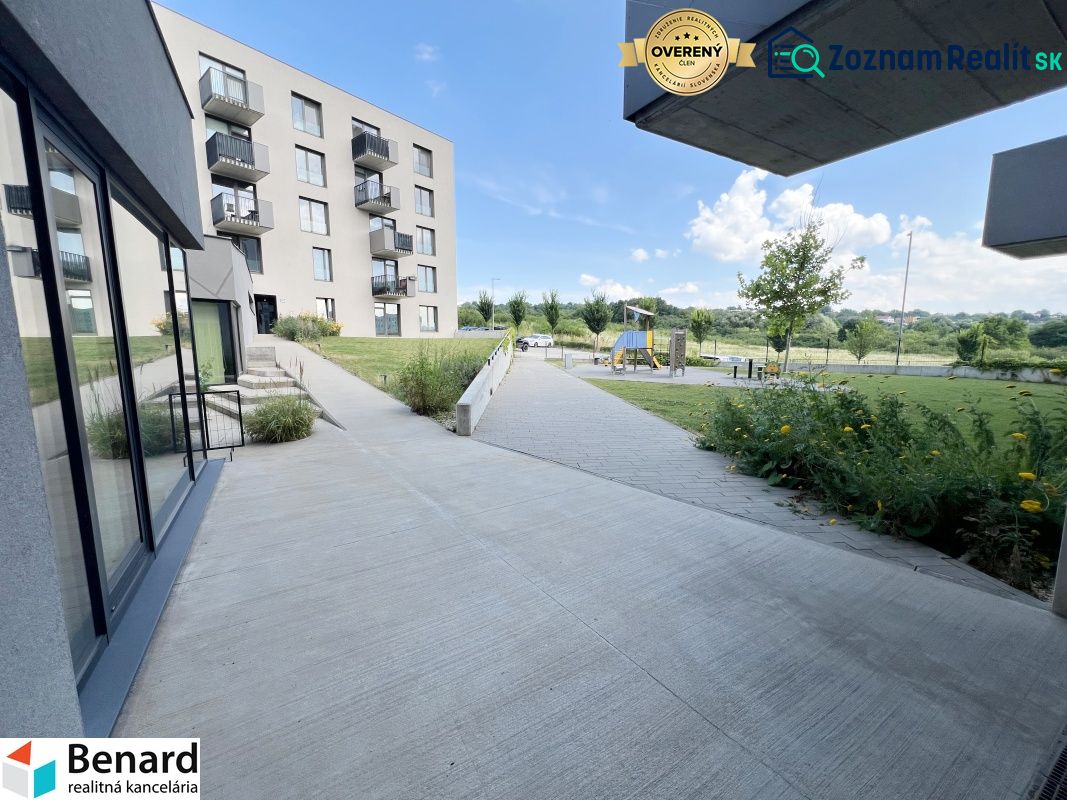Modern apartment complex on Sibírska Street in Prešov with greenery and a playground.
