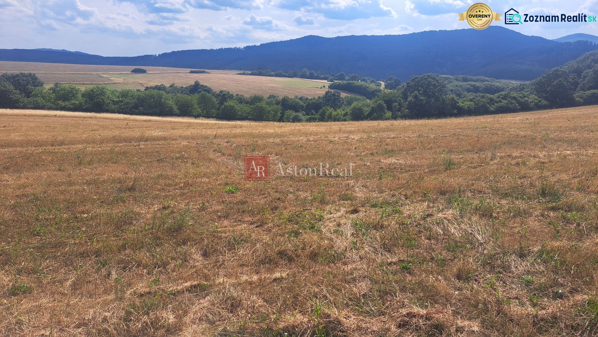 Extensive residential plots in Ostrá Lúka surrounded by green hills and meadows.