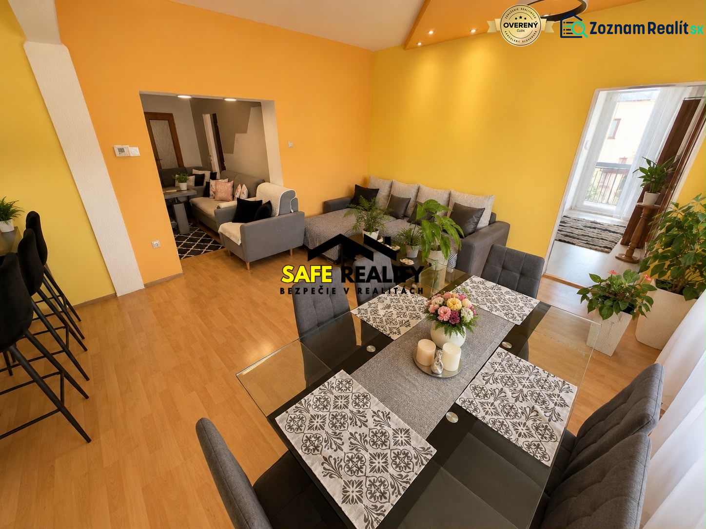 Colorful interior of a family house with a sofa and a dining table, floor with wooden decor.