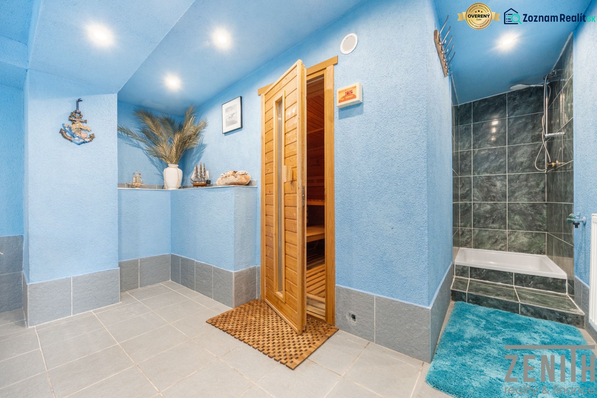Blue sauna and shower in a family house, decorative elements and ornamental vases in the corner.