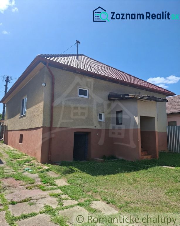 A family house in Ružiná with a gable roof and small windows.