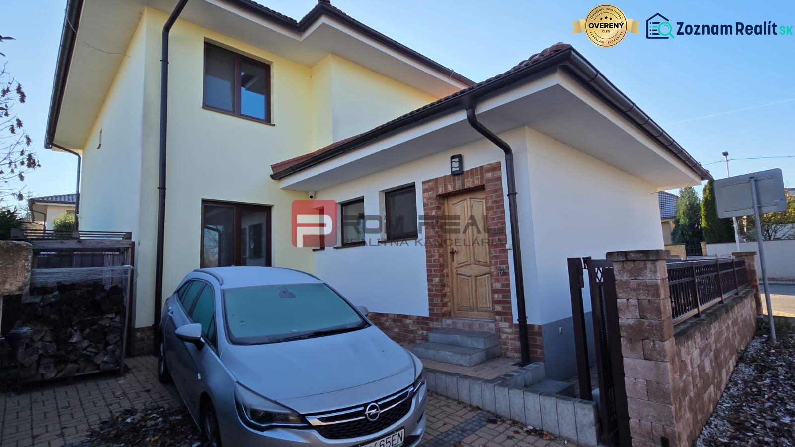 Family house on Pri Vápenickom potoku Street in Bratislava IV with a car in the parking lot.