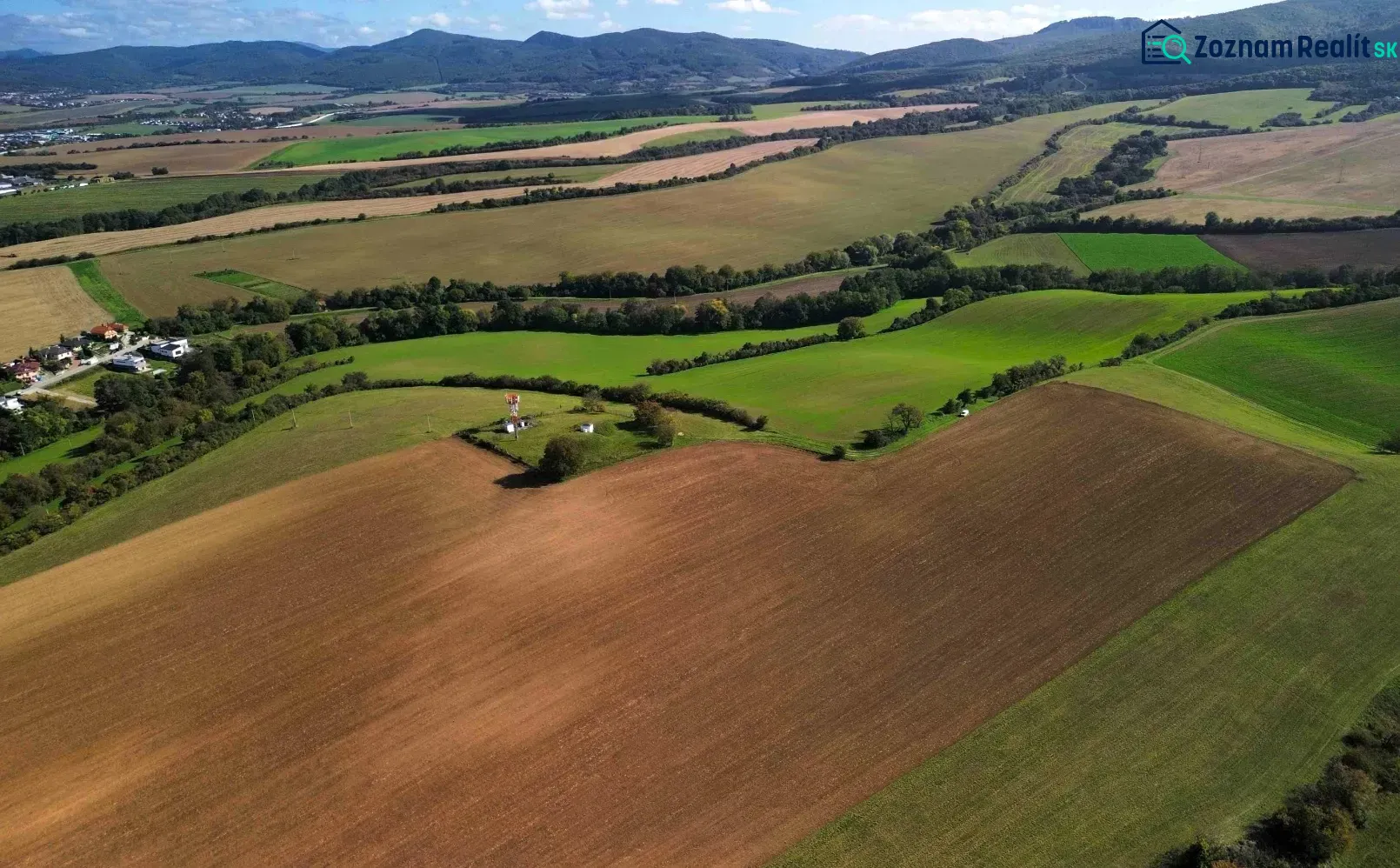Meadows and fields on agricultural and forest lands in Trenčianske Stankovce under the mountains.