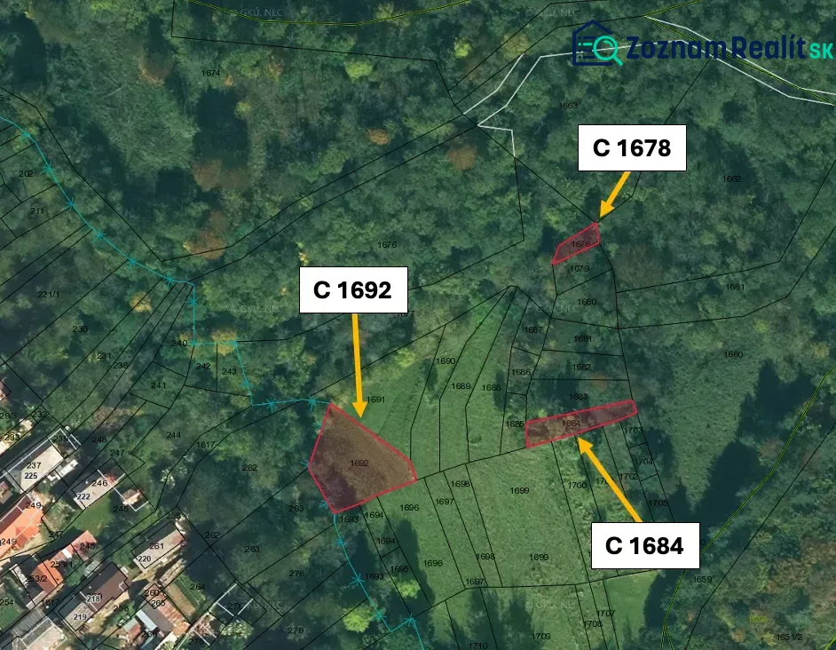 Aerial view of agricultural and forest lands in Ratkovské Bystré with parcels.