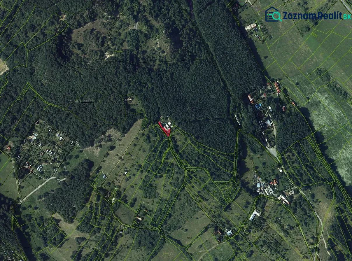 An aerial view of extensive forests and scattered plots around Krupina.