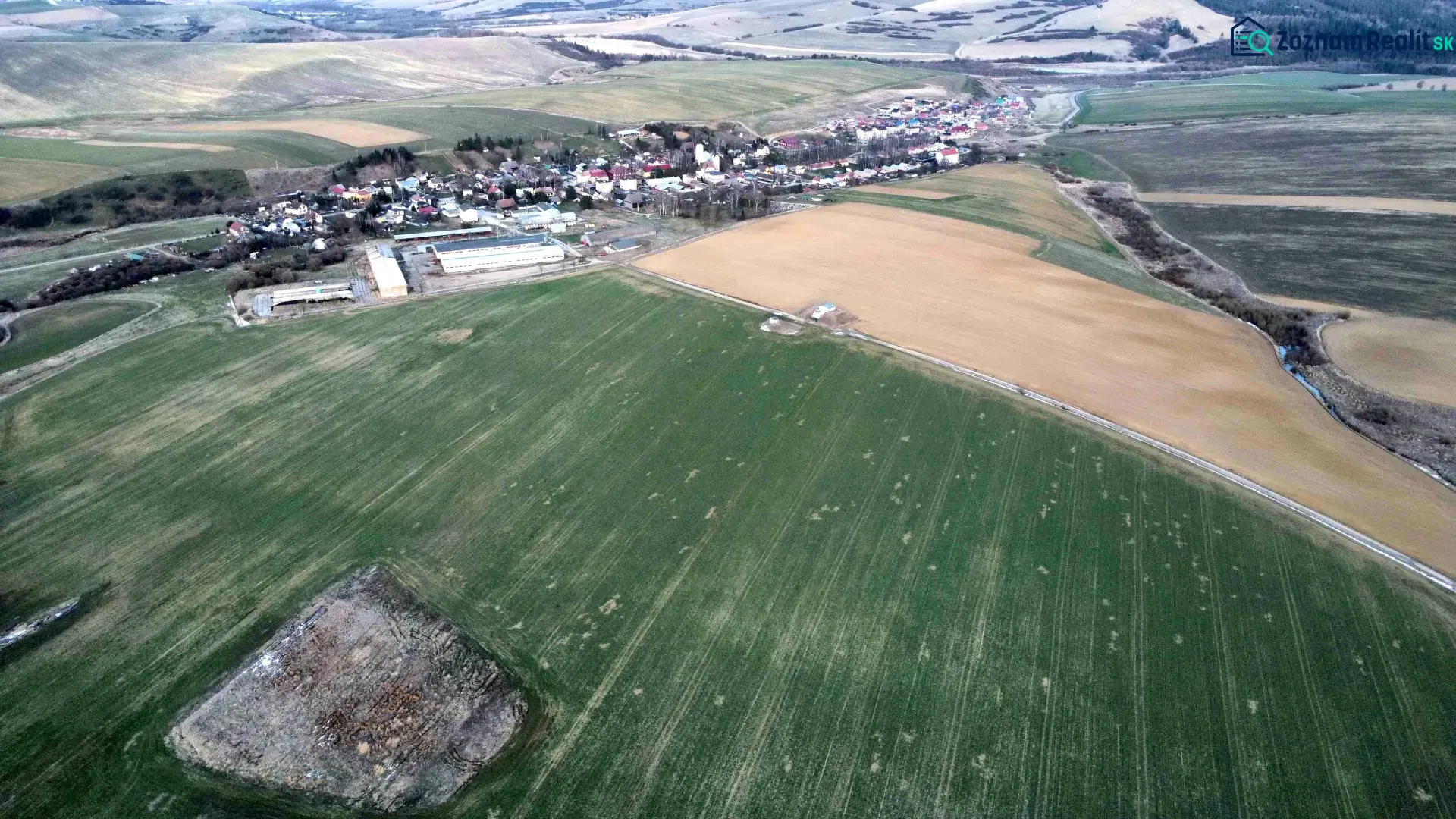 Agricultural and forest lands near Podhorany, capturing the landscape scenery and surrounding fields.
