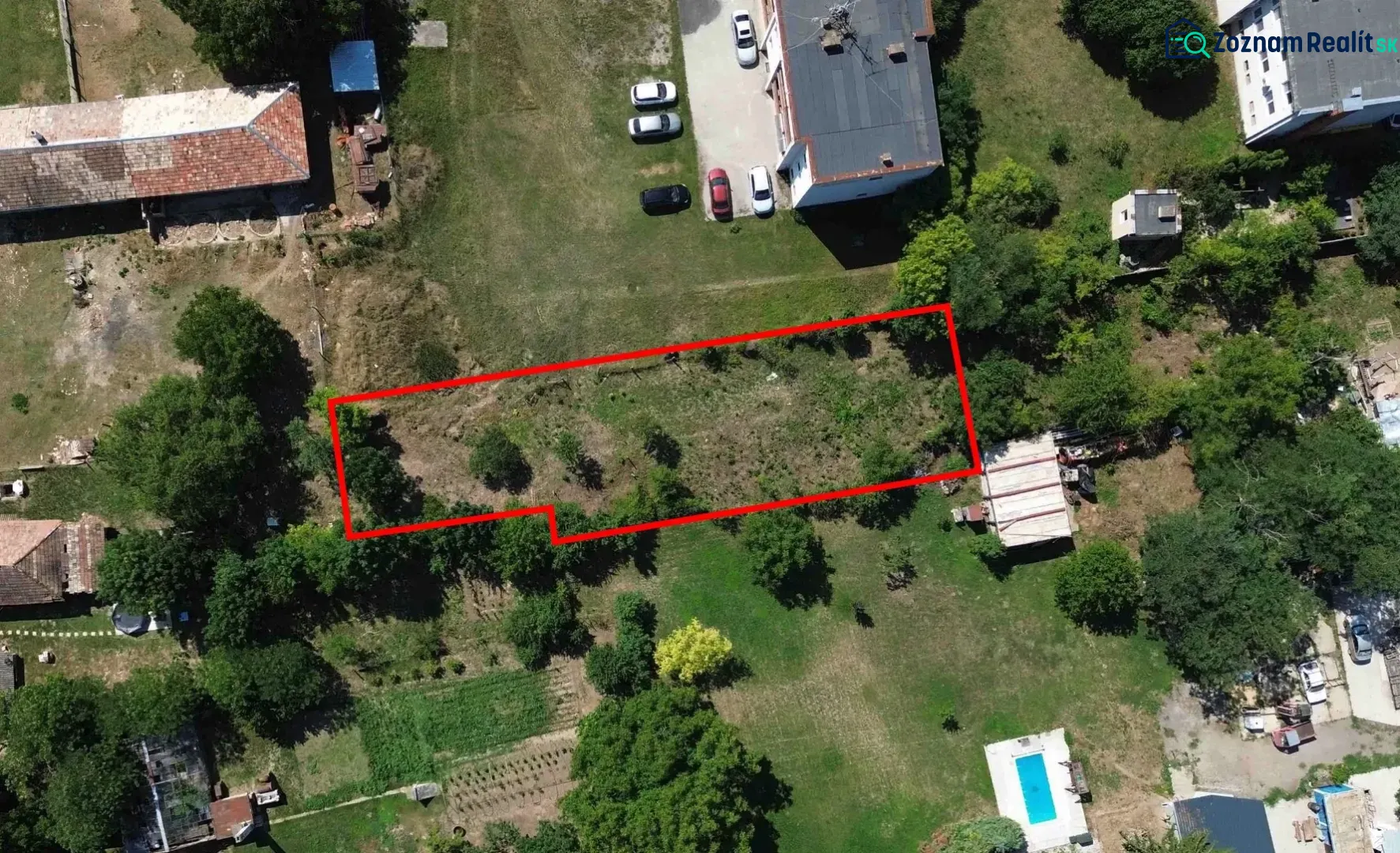Aerial view of plots - housing in Hronovce, bordered by a red line.