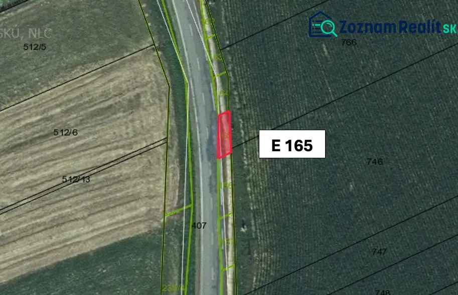 Aerial view of plots, agricultural and forest land in Hankovce near the road.