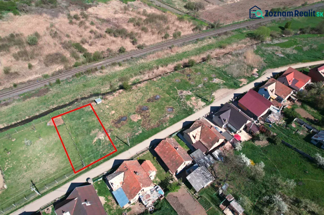 Plots - housing in Hodejov with a view of the railway track and neighboring houses.