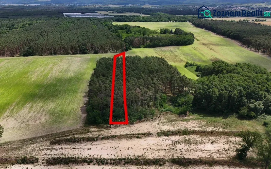 Aerial view of agricultural and forest land in Lozorno, surrounded by forests.