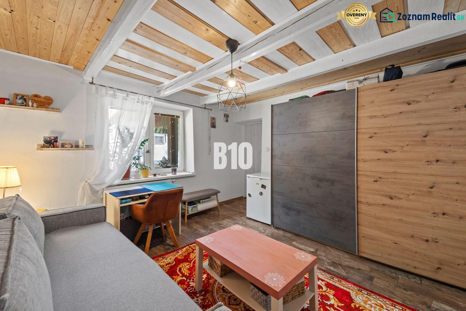 Living room of a family house with a floor and ceiling featuring a wooden decor.
