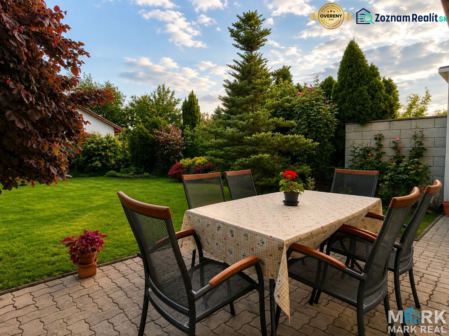 The terrace of a family house on Hrabová Street in Hamuliakovo with an outdoor table and chairs.