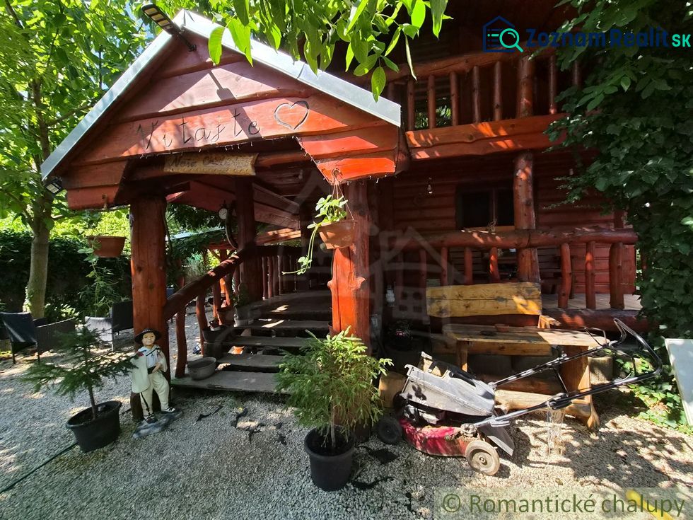 A rustic family house in Lehota with wooden decor surrounded by greenery.