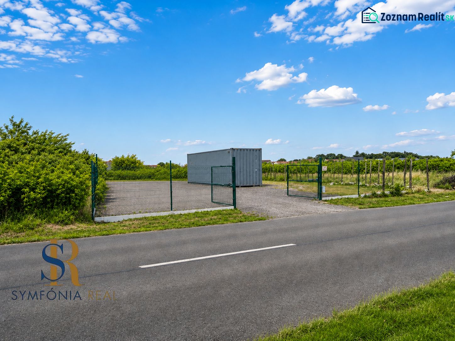 A plot for residential use in Modra on street 504 with fencing and a container.