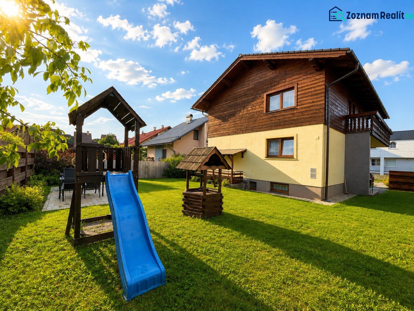 A family house on Hony in Liptovská Ondrášová with a children's playground and a well-maintained lawn.