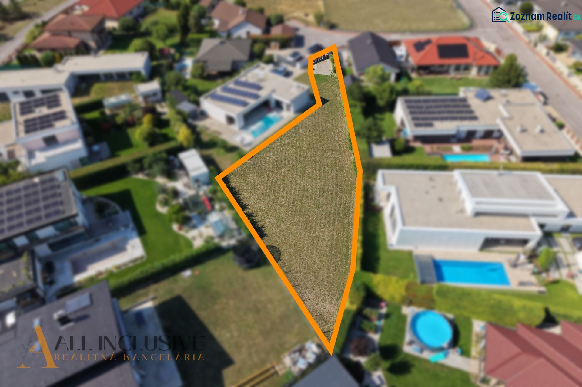 A residential plot on Mlynský Klin in Senec, surrounded by family houses.