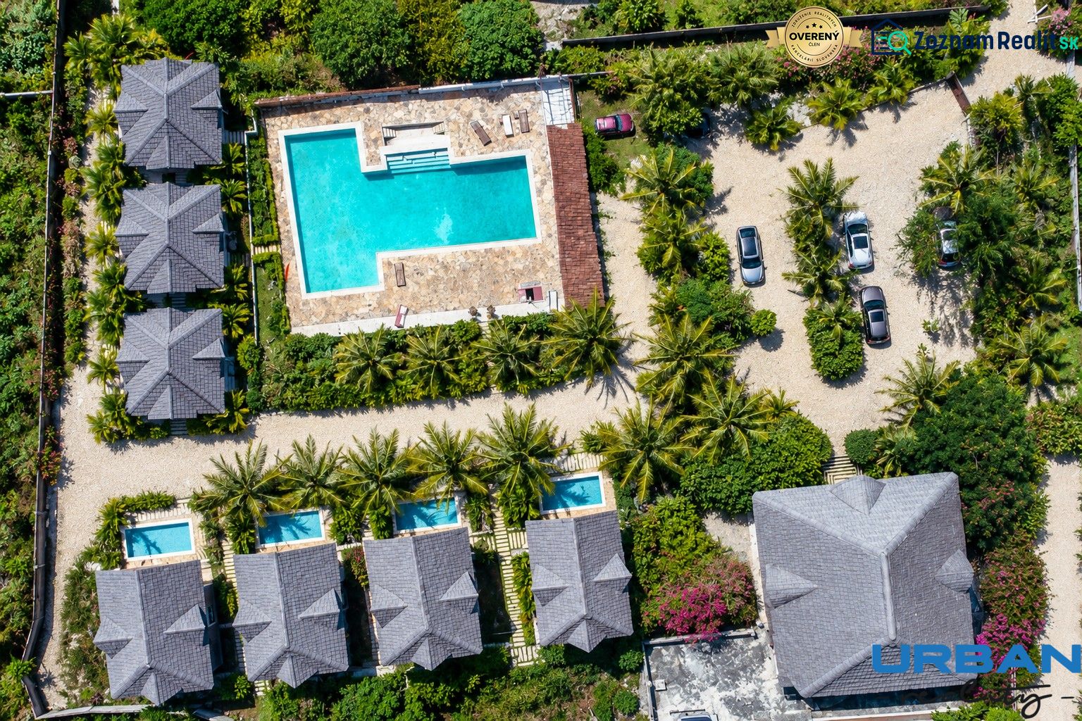 Aerial view of family houses in Pwani Mchangani with a pool and garden.