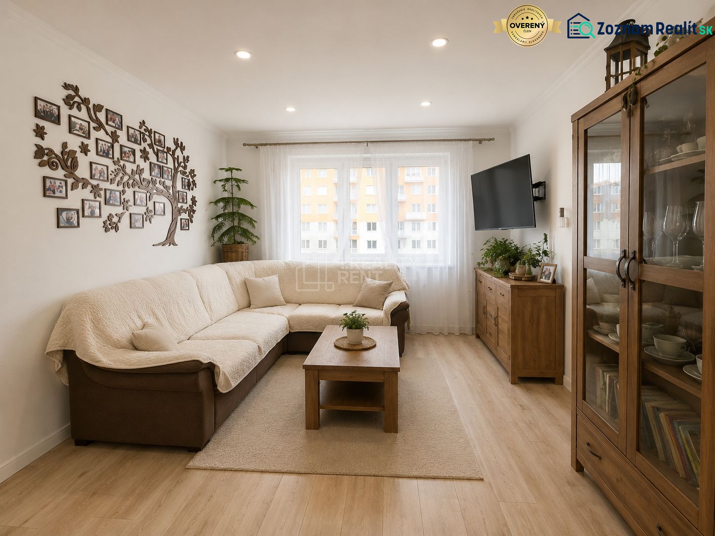 Living room in a 3-room apartment with a comfortable sofa and a wooden decor floor.