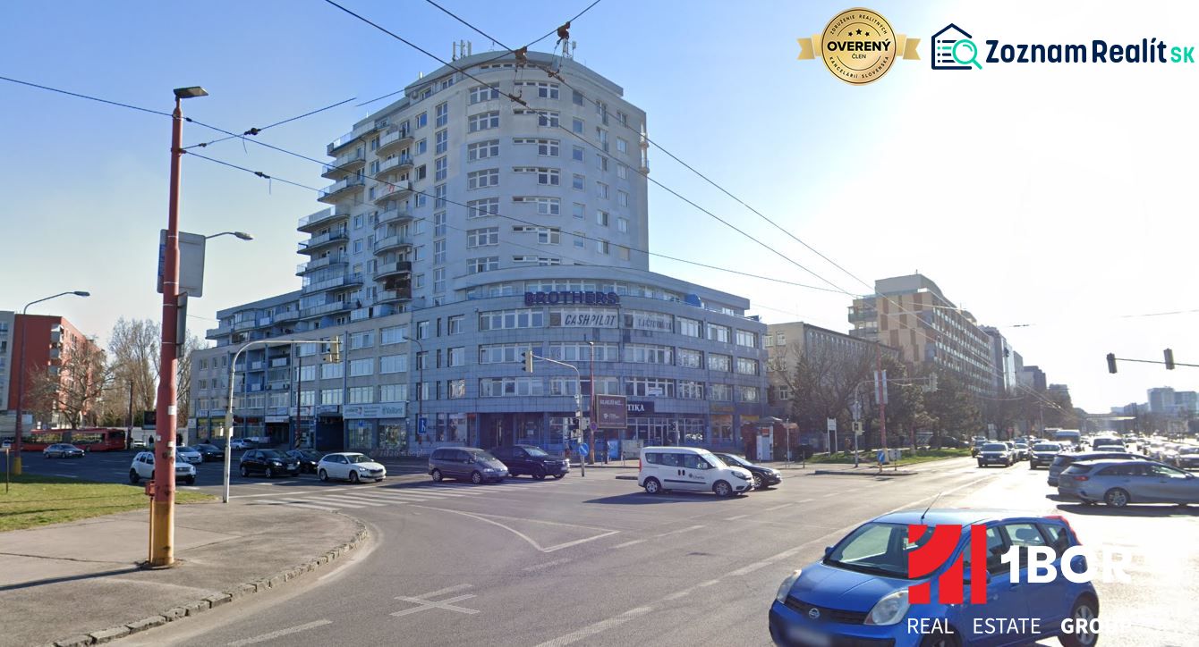 The building on Tomášikova Street in Bratislava - Ružinov, busy intersection and traffic.