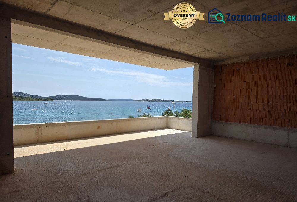 View from a 4-room apartment in SRIMA to the sea through a large window.