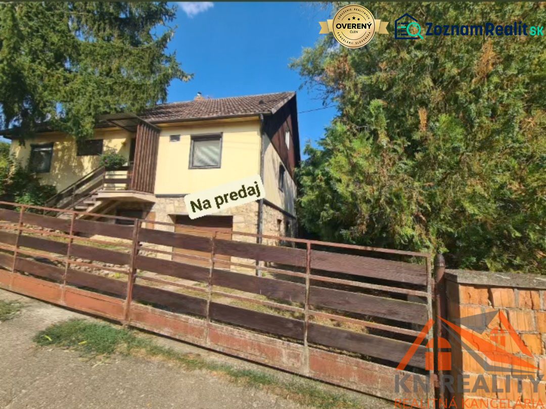 A family house in Svodín surrounded by greenery, with a stone terrace, for sale.