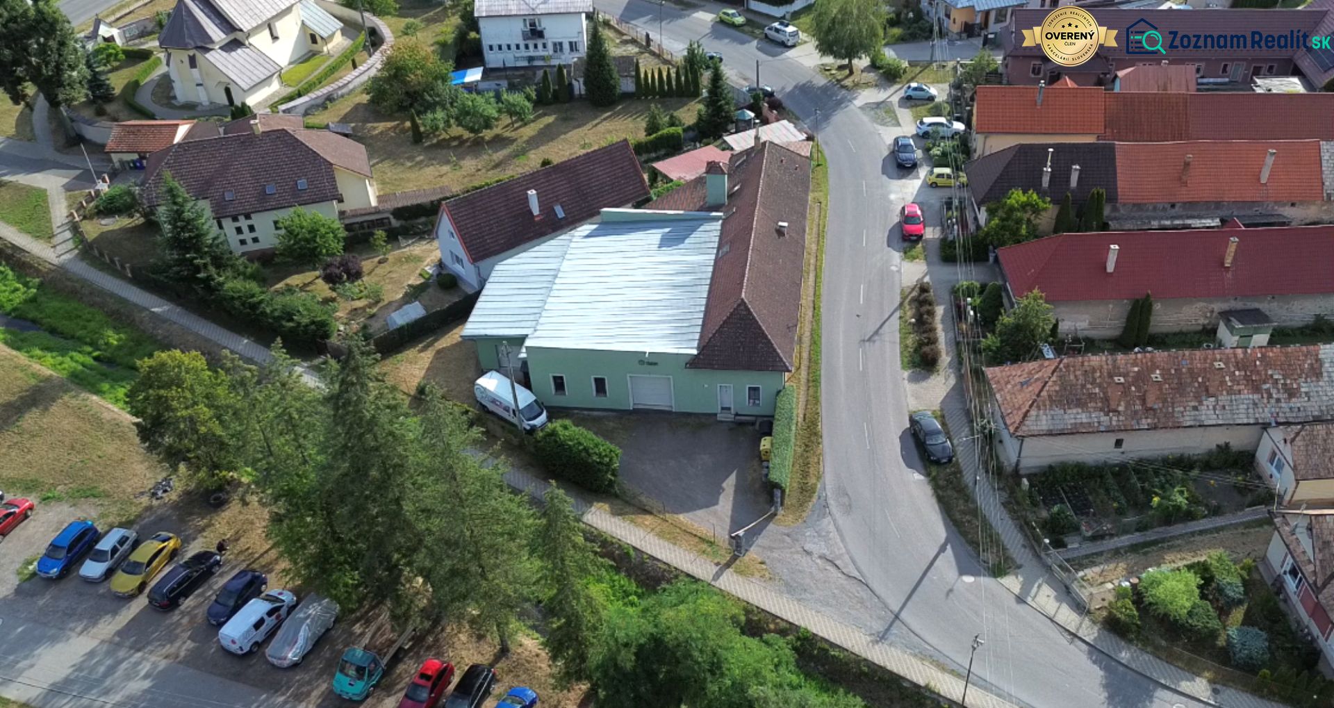An overhead view of the production facilities in Budča surrounded by houses and greenery.