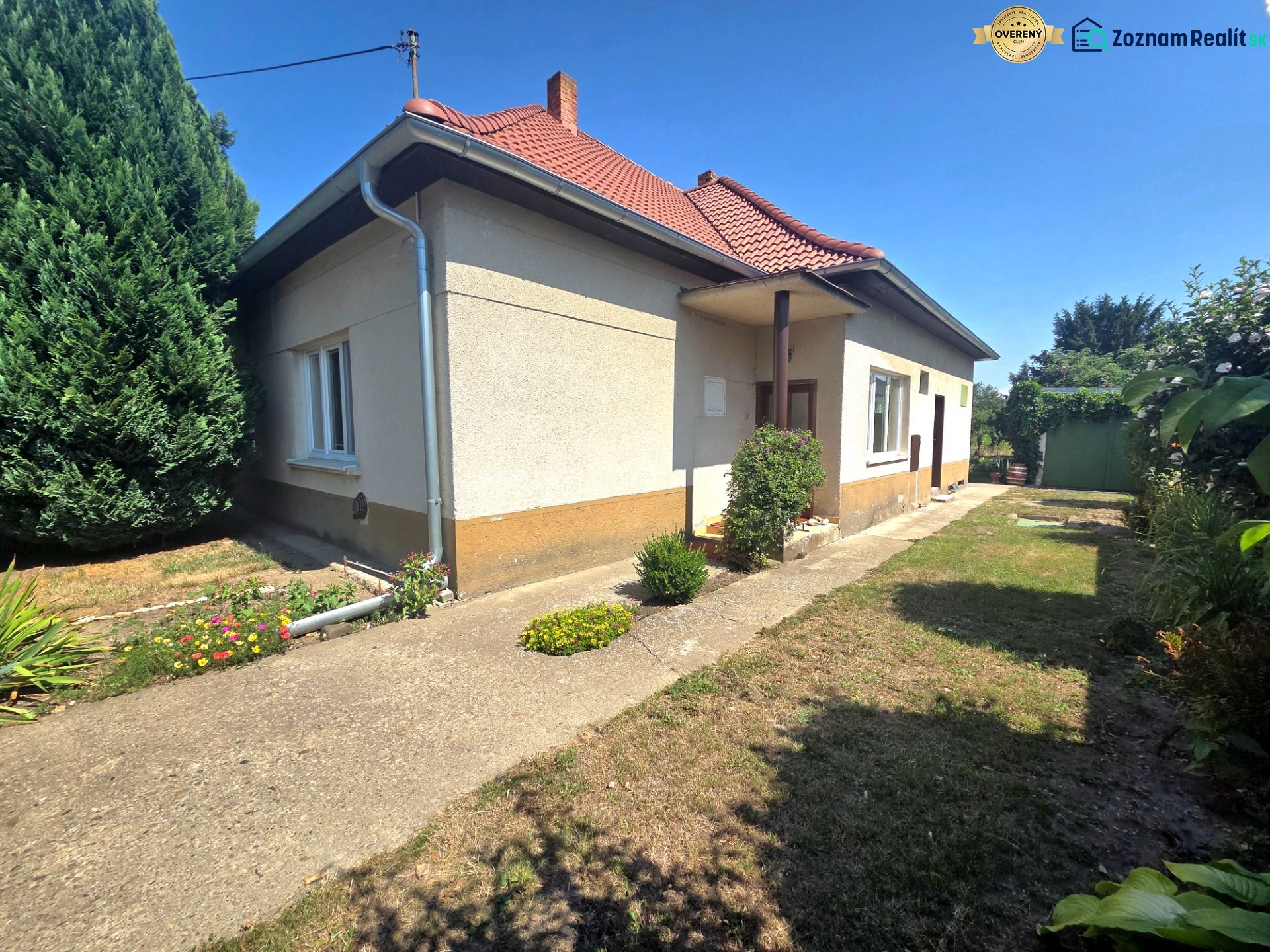 A family house on Murgašova Street in Šaľa with a landscaped garden and a balcony.