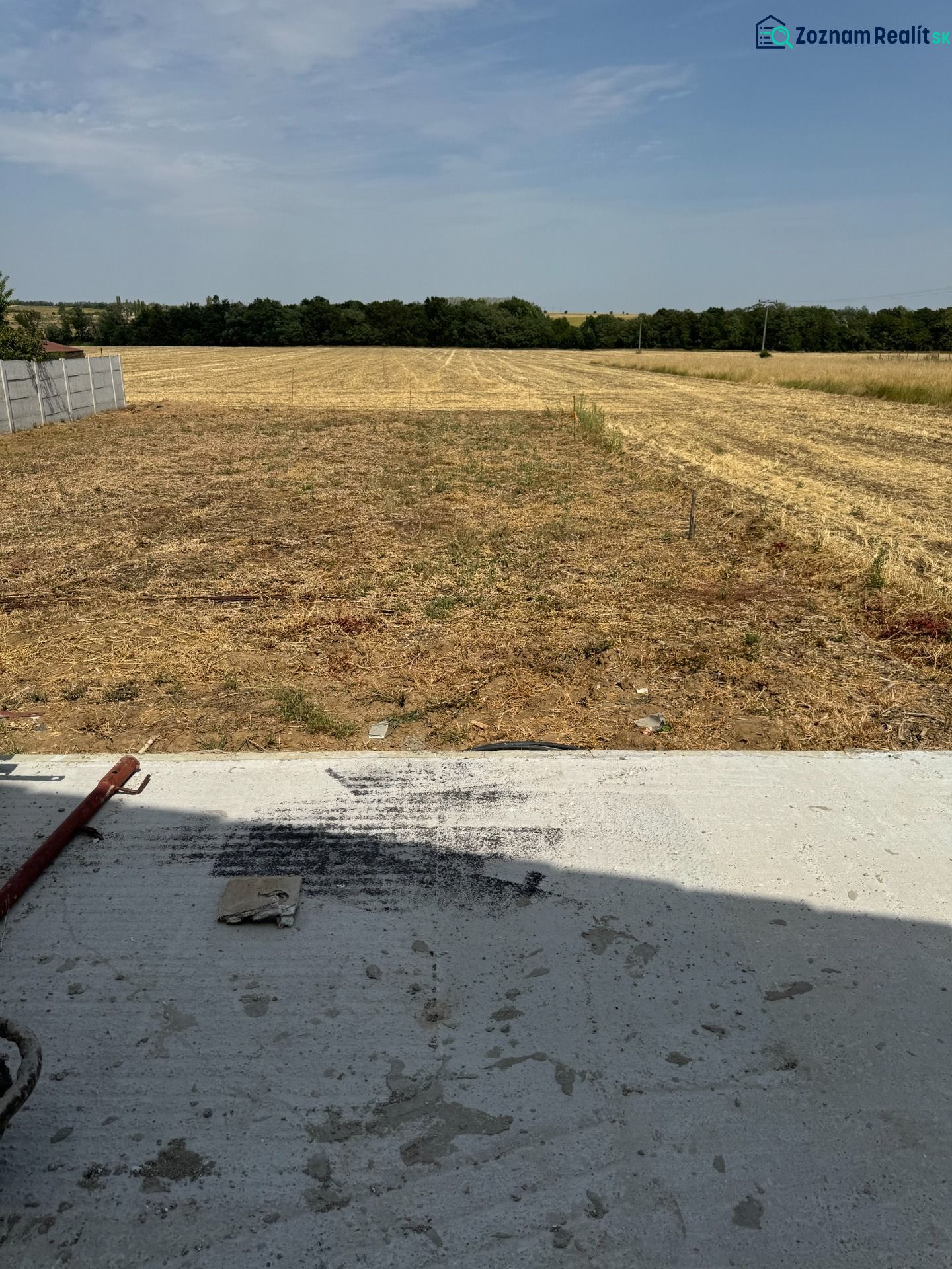 A field behind a family house in Suchá nad Parnou on Suchá nad Parnou street.