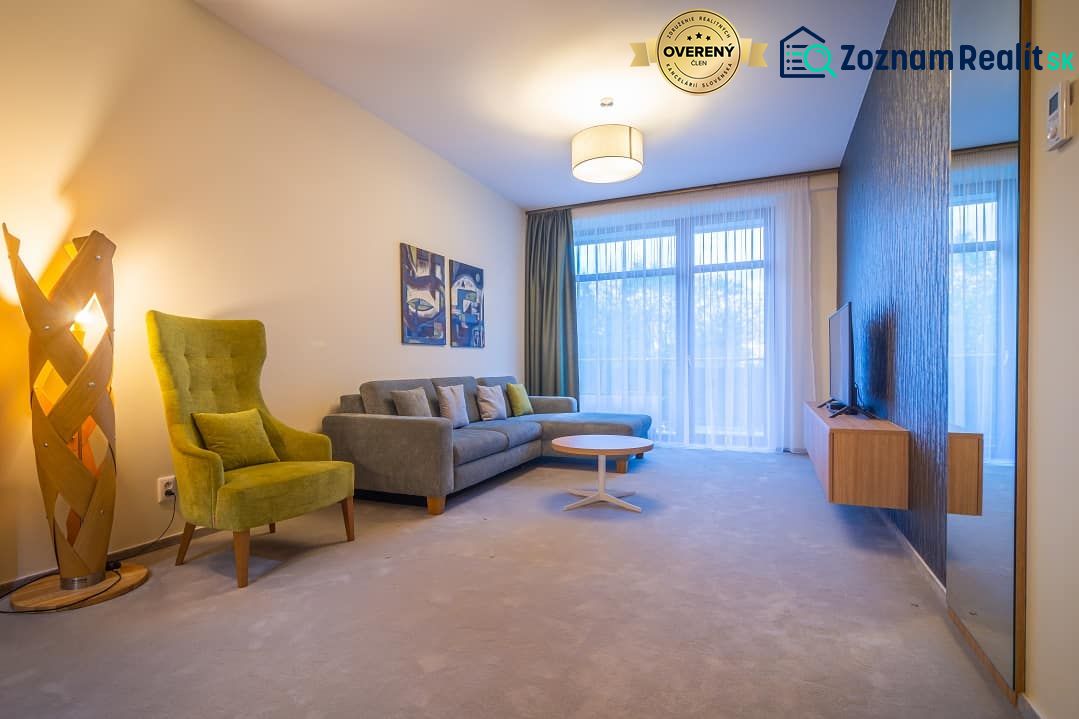 A stylish living area with a comfortable sofa set in the Holiday Apartment.