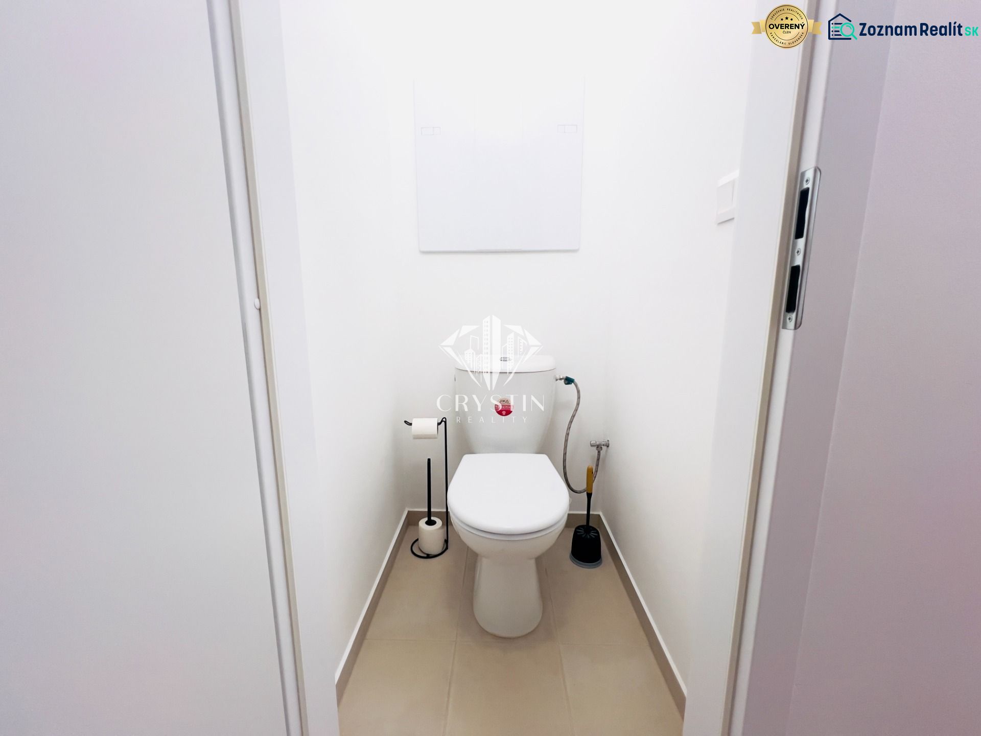 A bathroom with white walls in a two-room apartment, simple sanitary equipment.