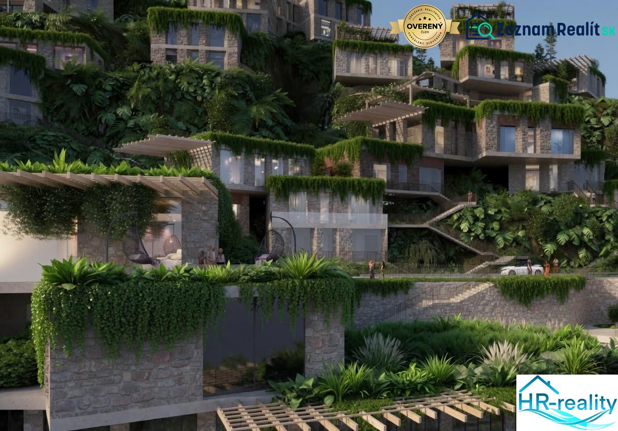 A villa in Dhërmi surrounded by lush greenery and stone facades, with terraces.