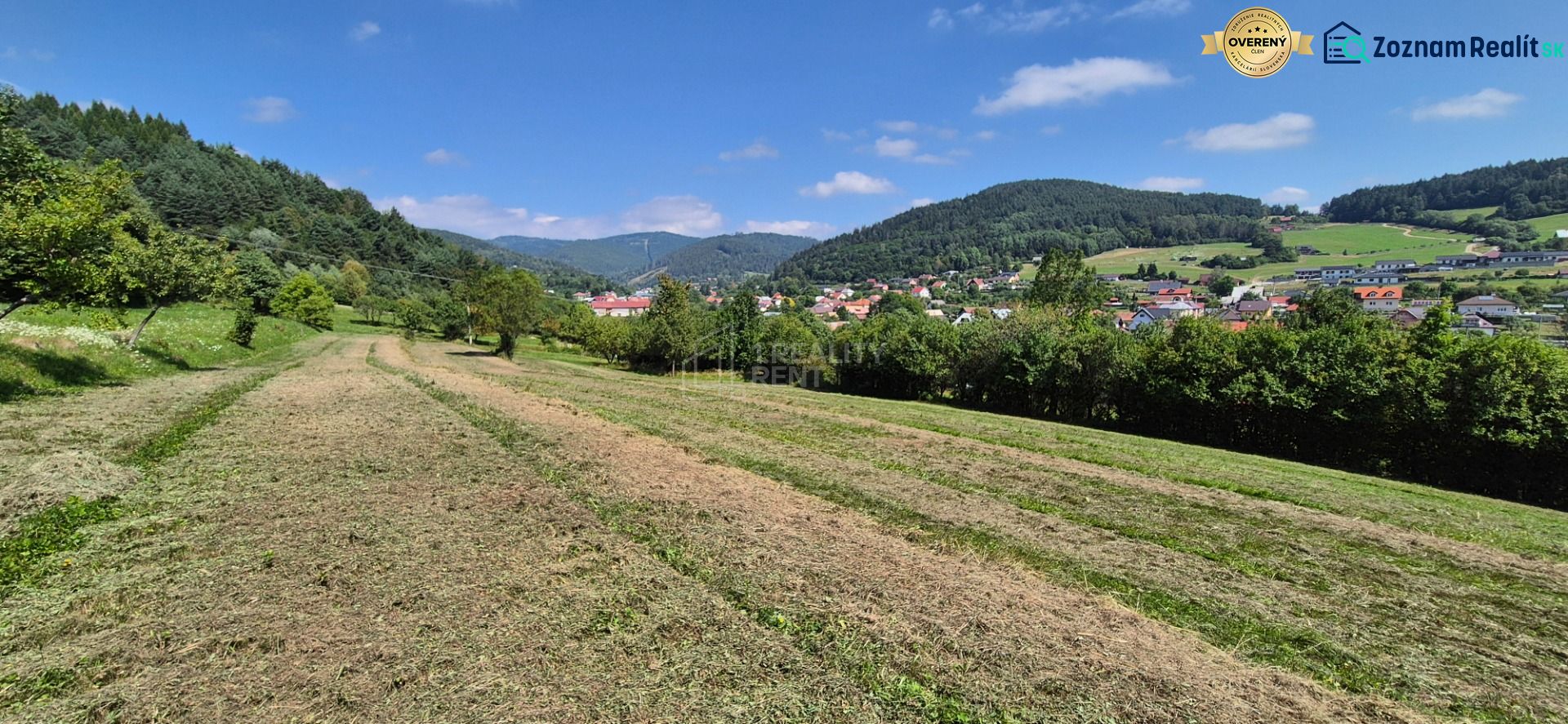 Plots - living in Nesluša, surrounded by green hills and scattered buildings.