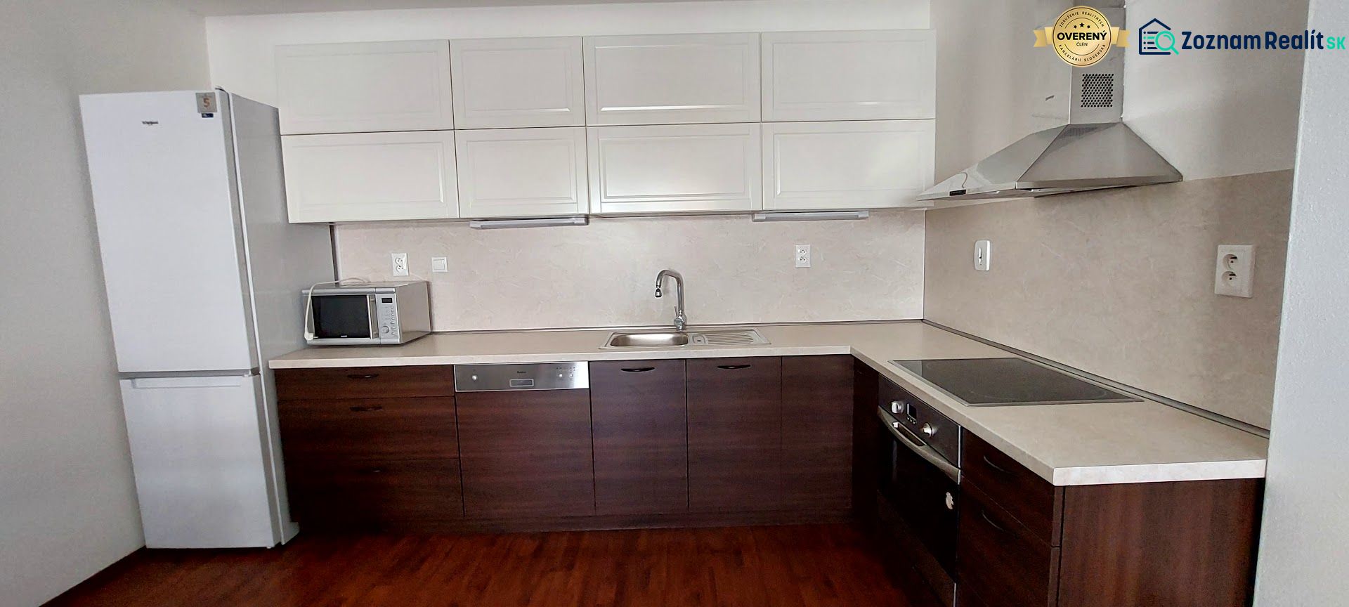 Kitchen with microwave and refrigerator, wooden decor flooring, 3-room apartment.