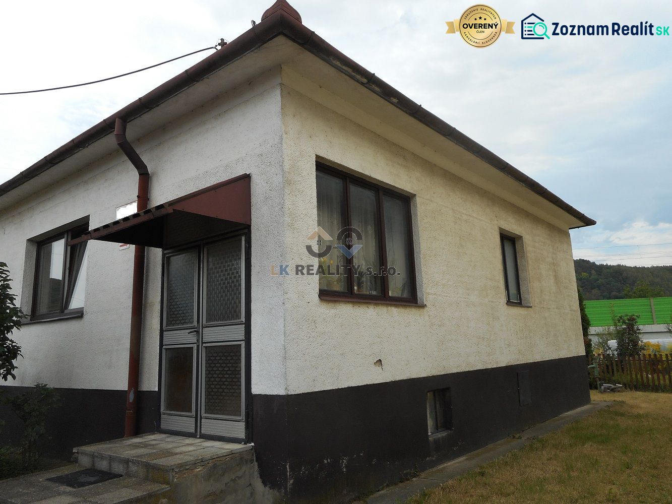 A family house in Trenčín with a sloped roof and plaster facade.