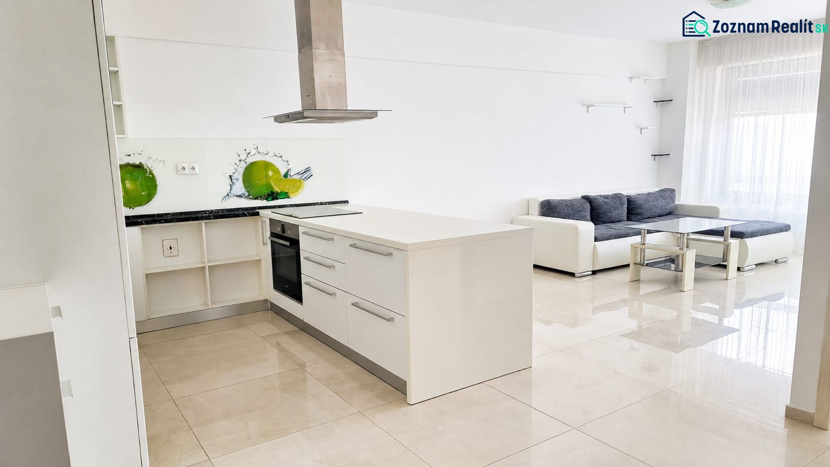 A spacious kitchen connected to the living room, light tones, and stylish graphic details.
