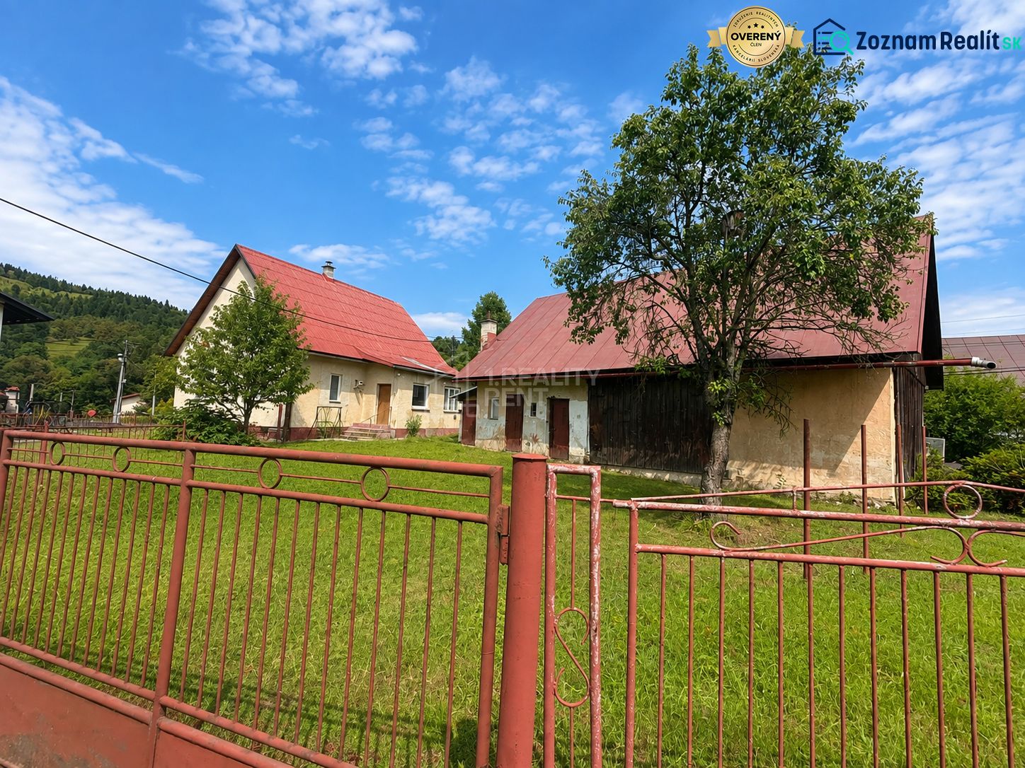 A family house in Oščadnica on Oščadnica street with a red roof and a large garden.