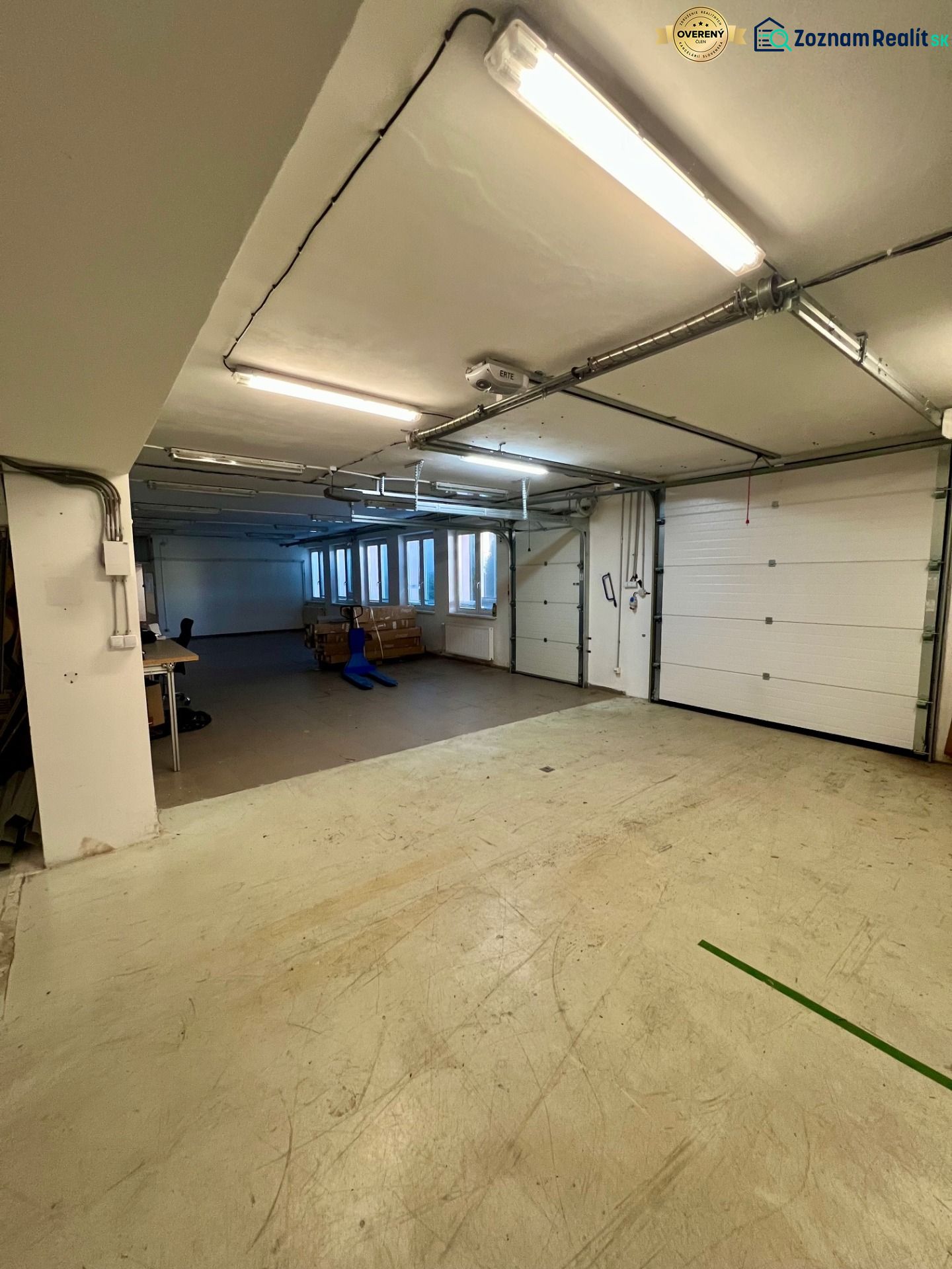 Interior from the category Warehouses and halls with garage doors and lighting.