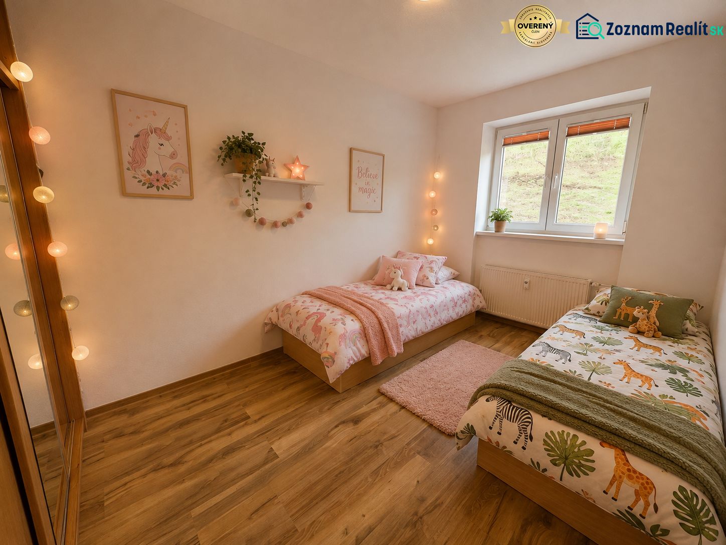 Children's room in a 3-room apartment with a wooden decor floor, cheerful beds, and decorations.