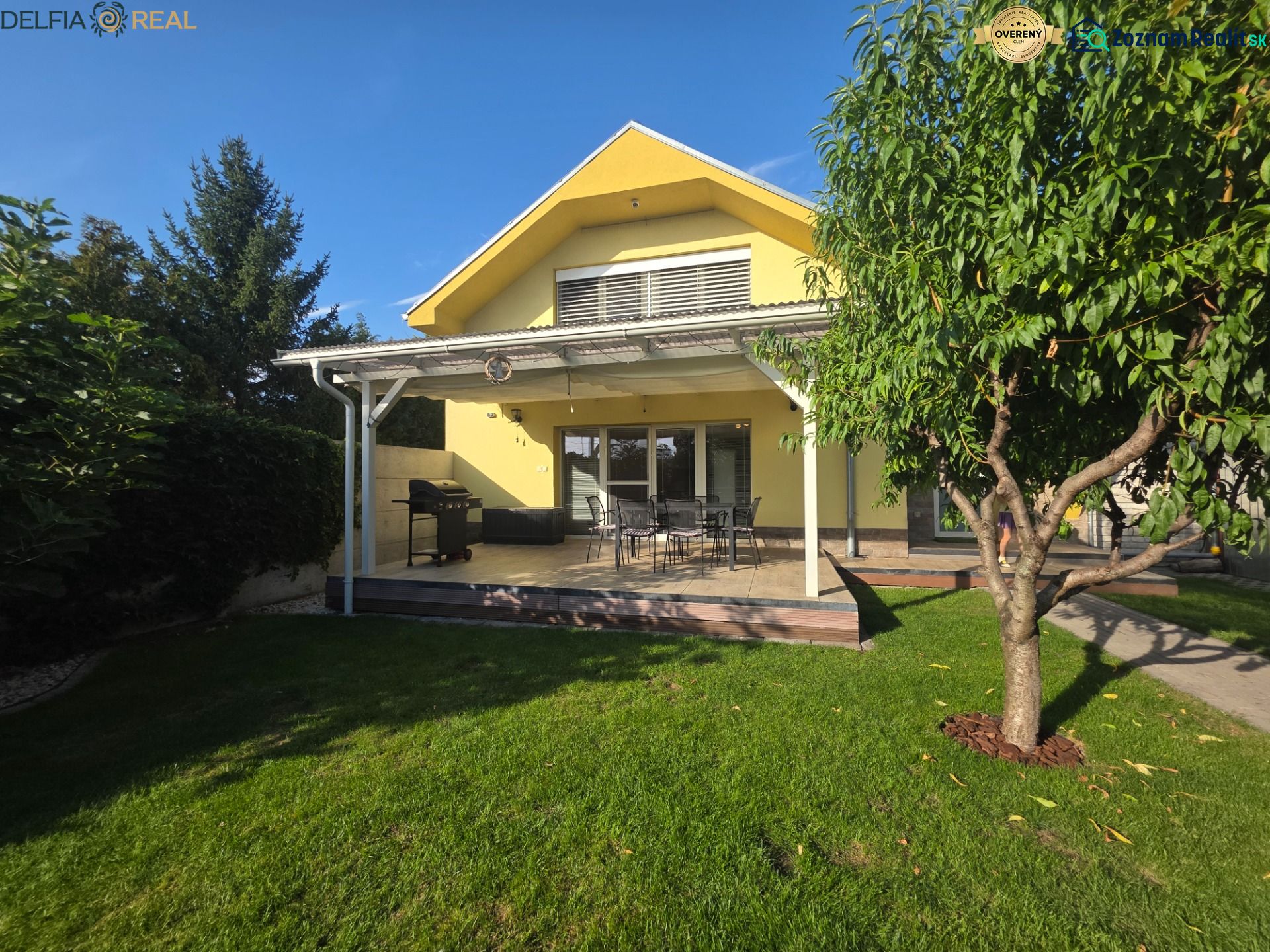 A family house in Oľdza with a garden, terrace, and a gazebo for seating.